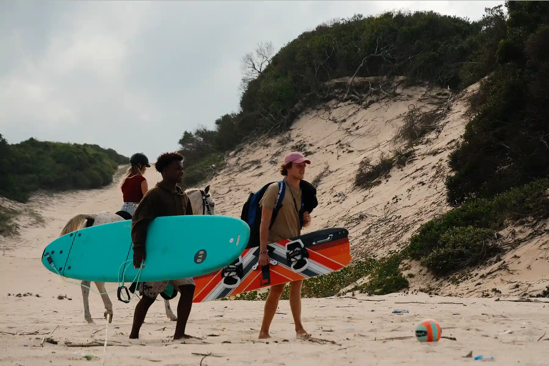 Preparing to go surfing and Riding on the beach
