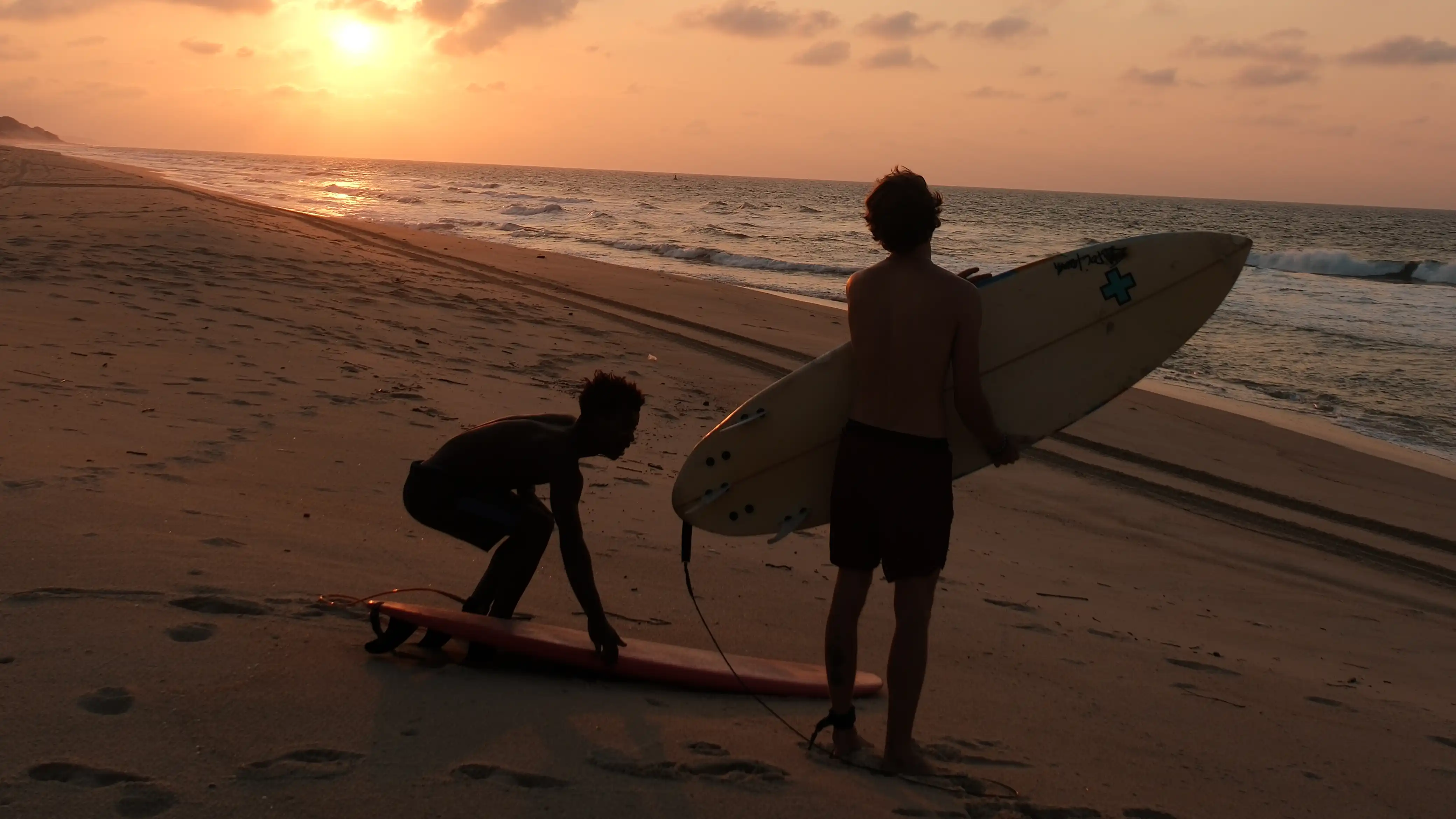 Surfing at Sunset at Dune Beach Hostel in Mozambique